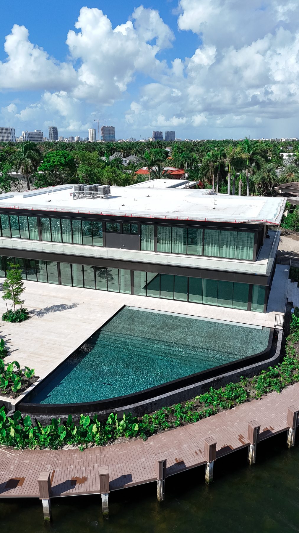 Drone view of the pool edge meeting the seawall