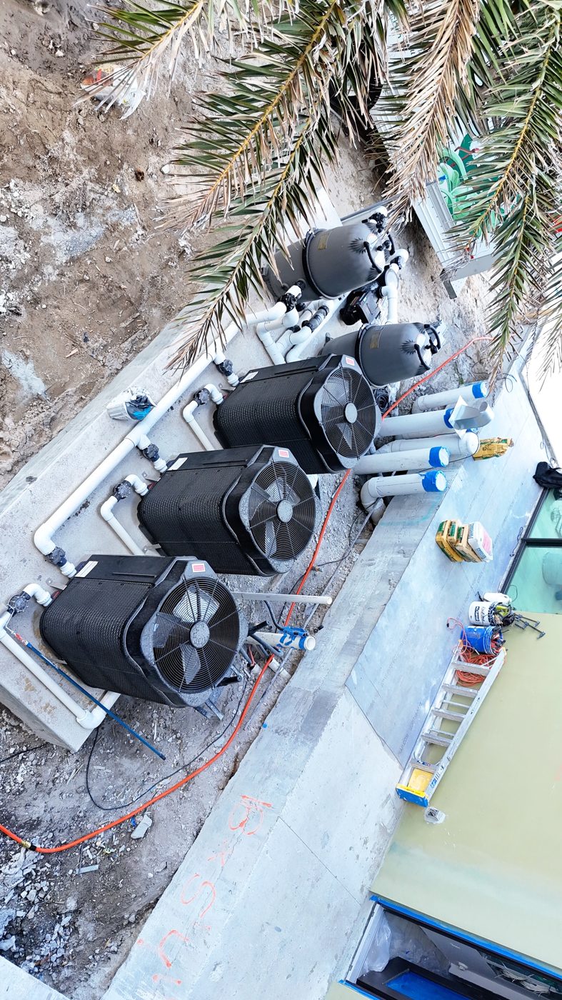 Pool equipment pad with Jandy pumps, filters and heat pumps