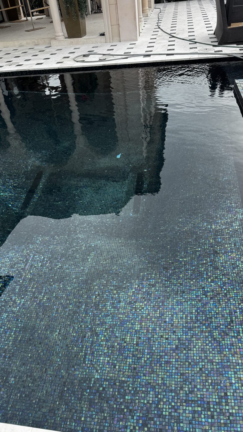 Water rising over the new glass tile during the fill
