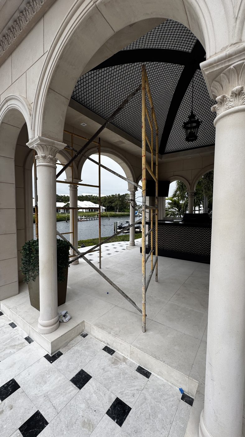 Painters' scaffolding under the loggia next to the new deck