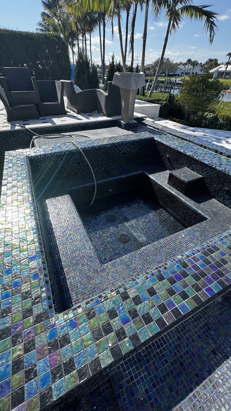 The re-tiled spa and its spillover before the fill